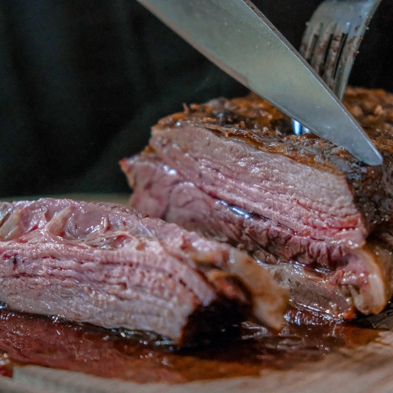 Close-up of slow-cooked beef being sliced